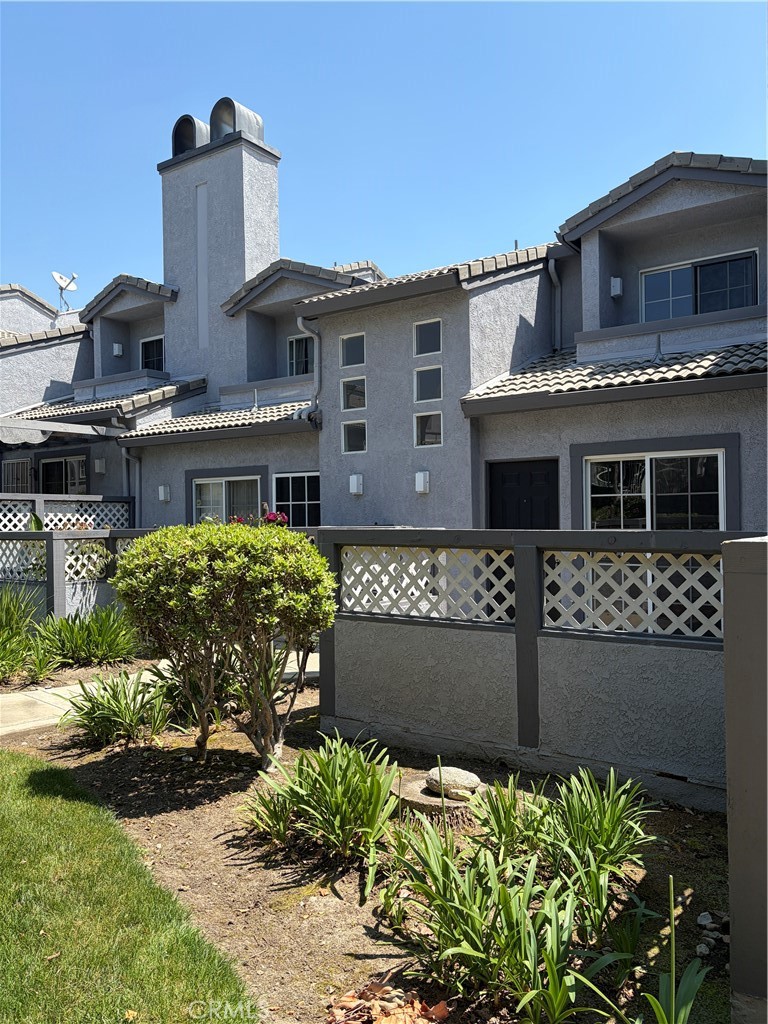 8248 Inglenook Place Rancho Cucamonga, CA 91730 - Photo 5 of 12 front view of a house with a street