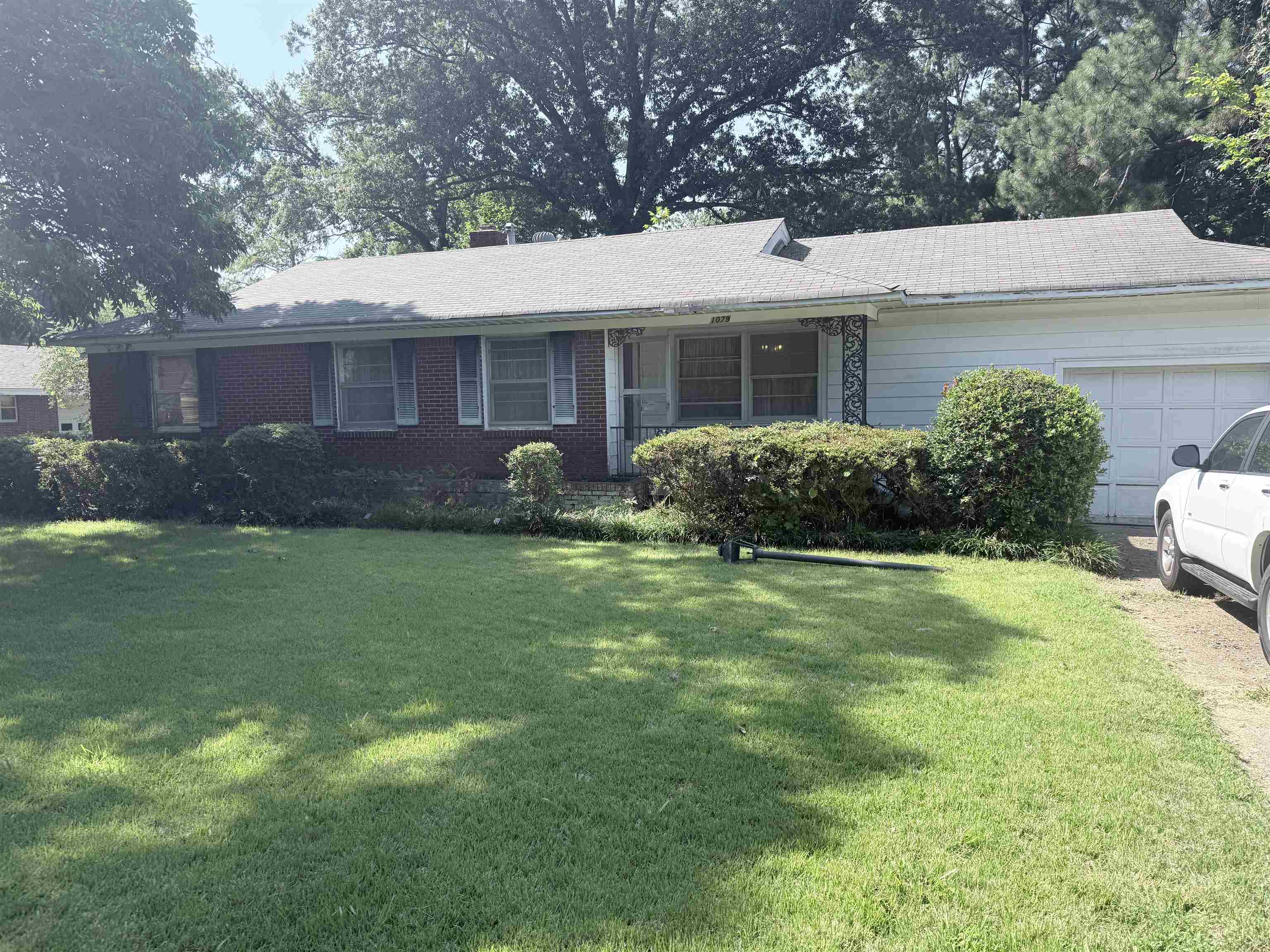 1079 Alden Road Memphis, TN 38116 - Photo 1 of 14 Brick and siding exterior with a shingle roof