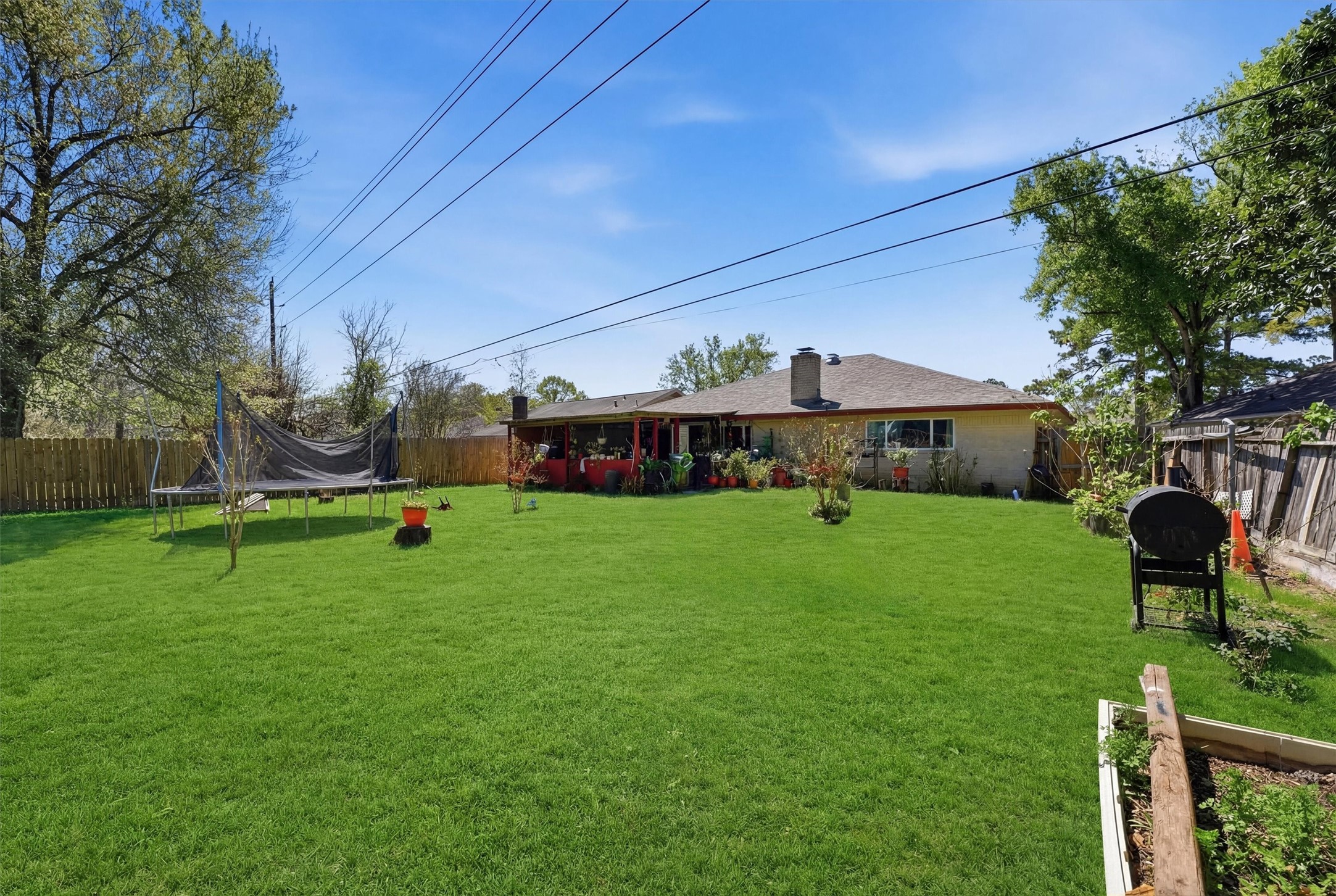 6203 Sunnygate Drive Spring, TX 77373 - Photo 14 of 23 a front view of a house with garden