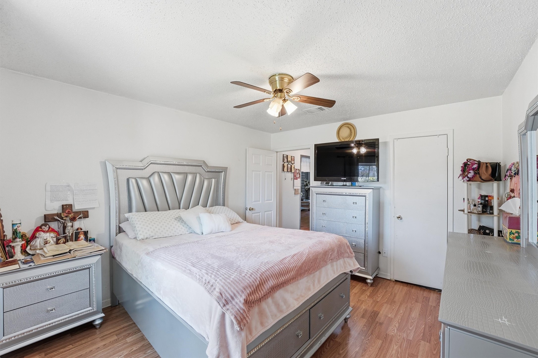 6203 Sunnygate Drive Spring, TX 77373 - Photo 15 of 23 a bedroom with a bed and a flat screen tv