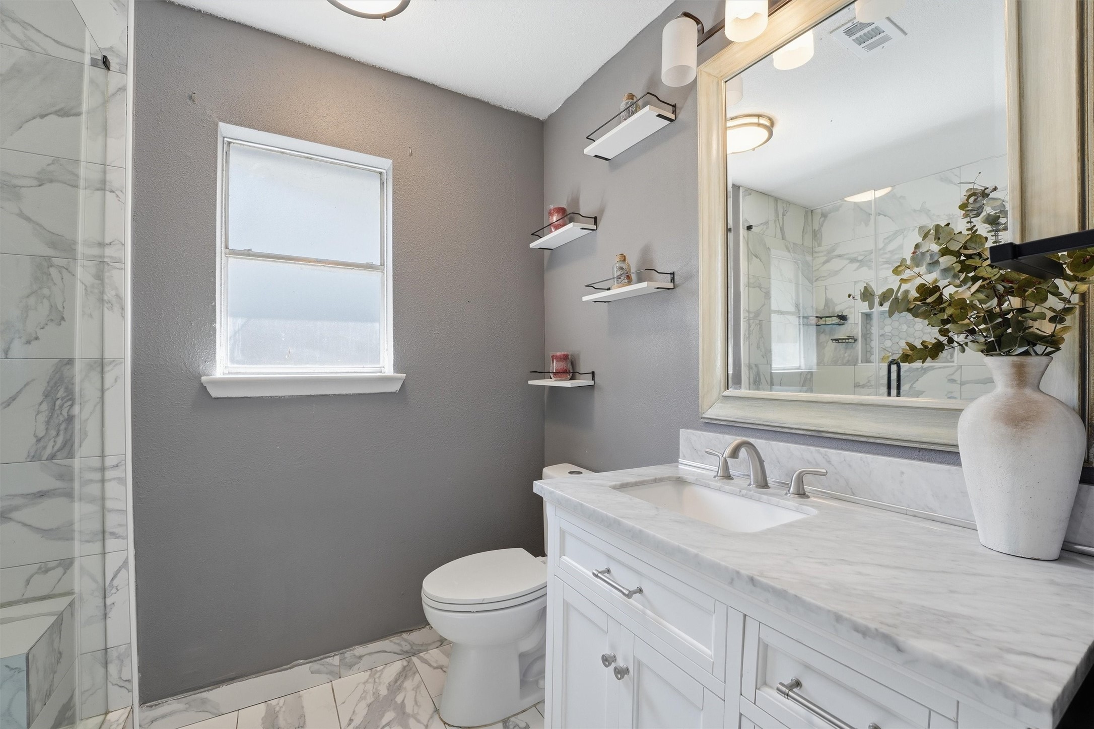 6203 Sunnygate Drive Spring, TX 77373 - Photo 16 of 23 a bathroom with a granite countertop sink mirror vanity and toilet