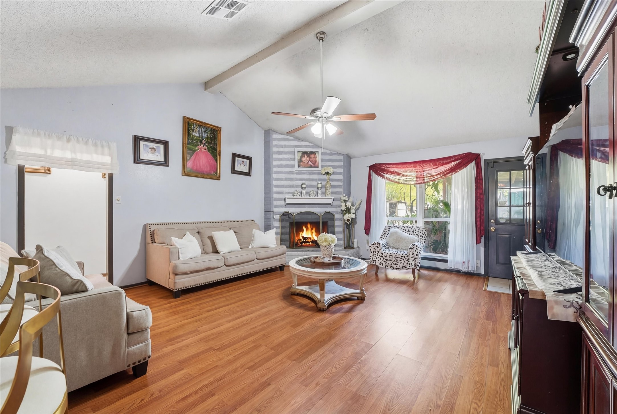 6203 Sunnygate Drive Spring, TX 77373 - Photo 19 of 23 a living room with furniture fireplace and flat screen tv