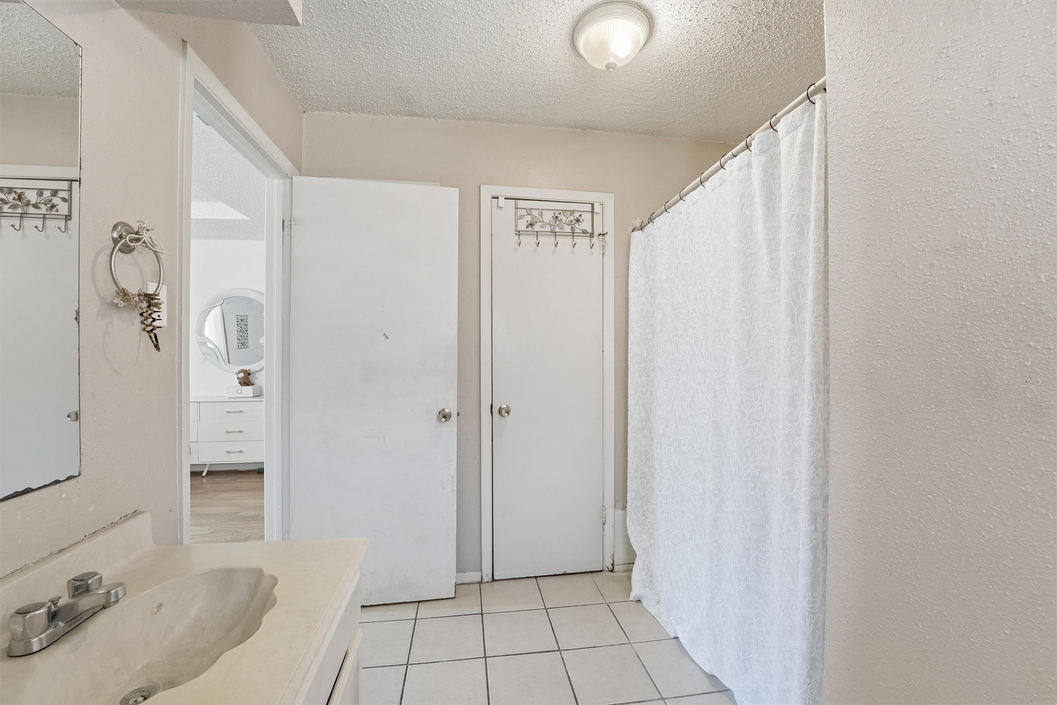 6203 Sunnygate Drive Spring, TX 77373 - Photo 23 of 23 a bathroom with a sink and shower