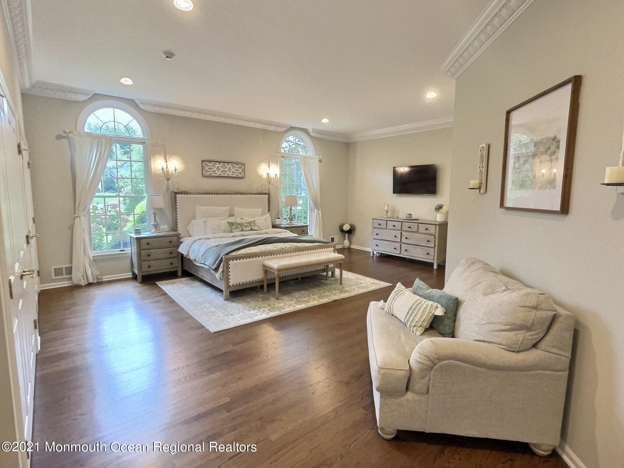 21 Dearborn Drive Holmdel, NJ 07733 - Photo 13 of 48 a bedroom with furniture and a wooden floor