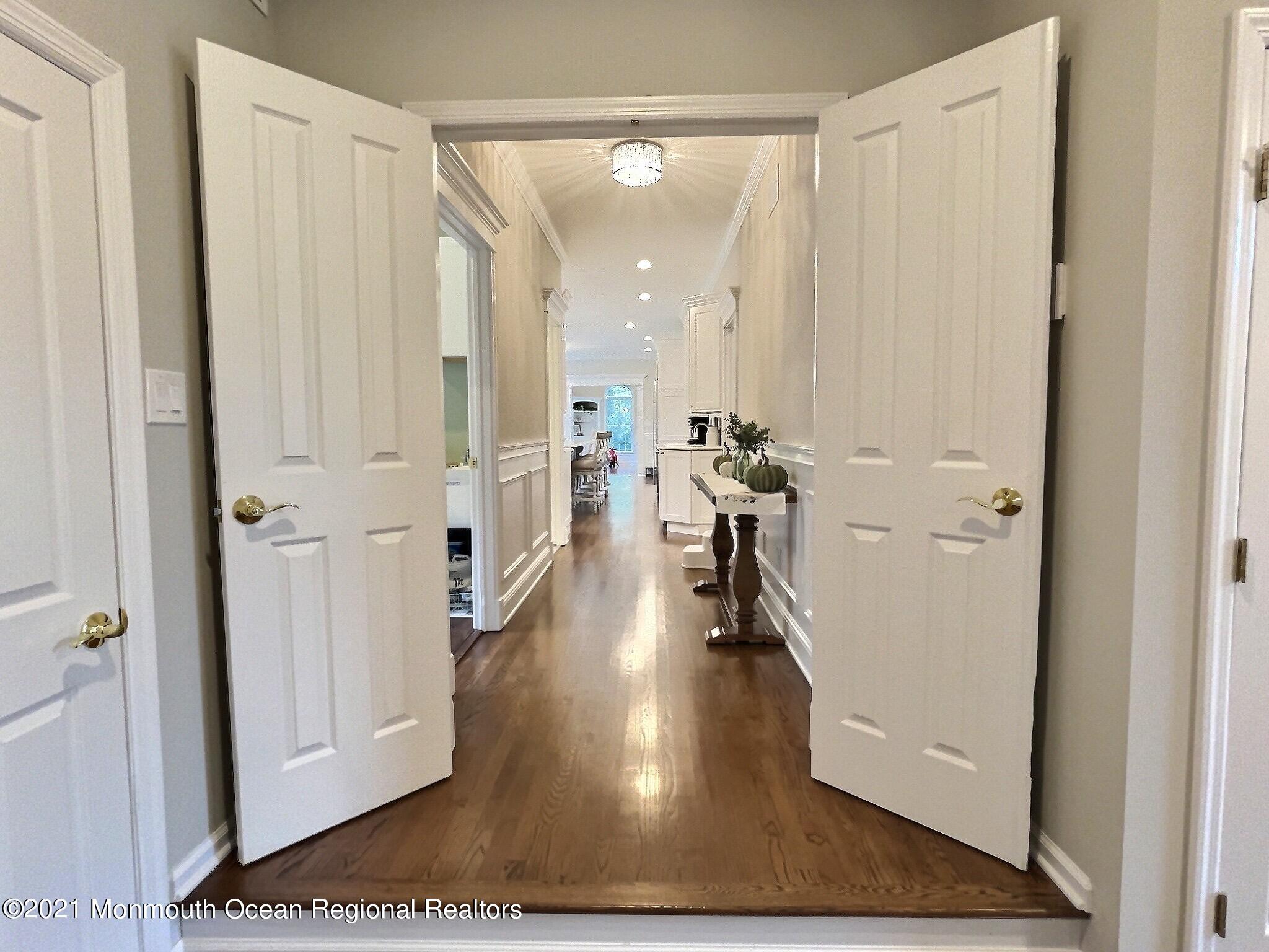 21 Dearborn Drive Holmdel, NJ 07733 - Photo 15 of 48 a view of a hallway with wooden floor windows and livingroom