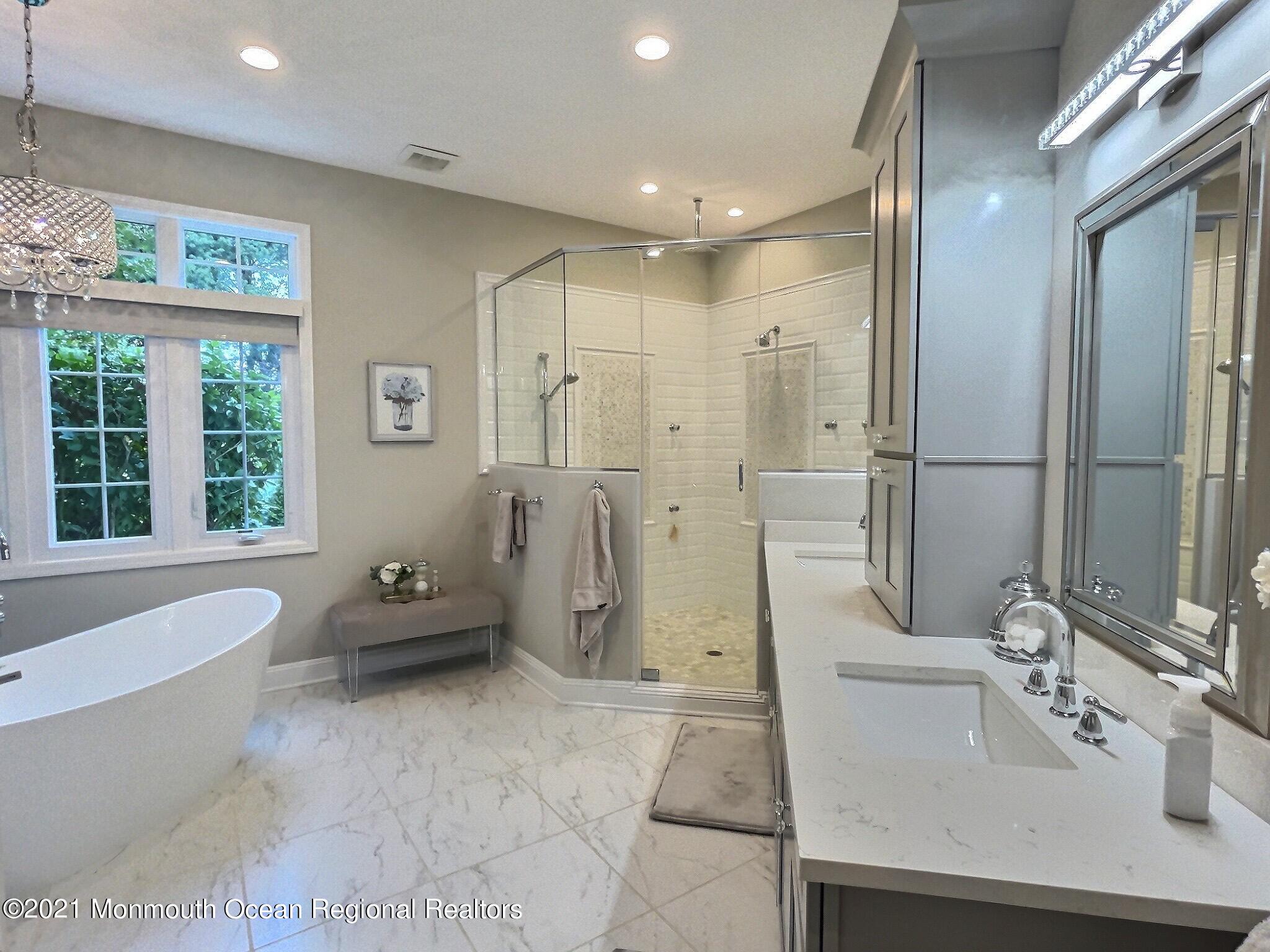 21 Dearborn Drive Holmdel, NJ 07733 - Photo 18 of 48 a bathroom with a double vanity sink bathtub and shower