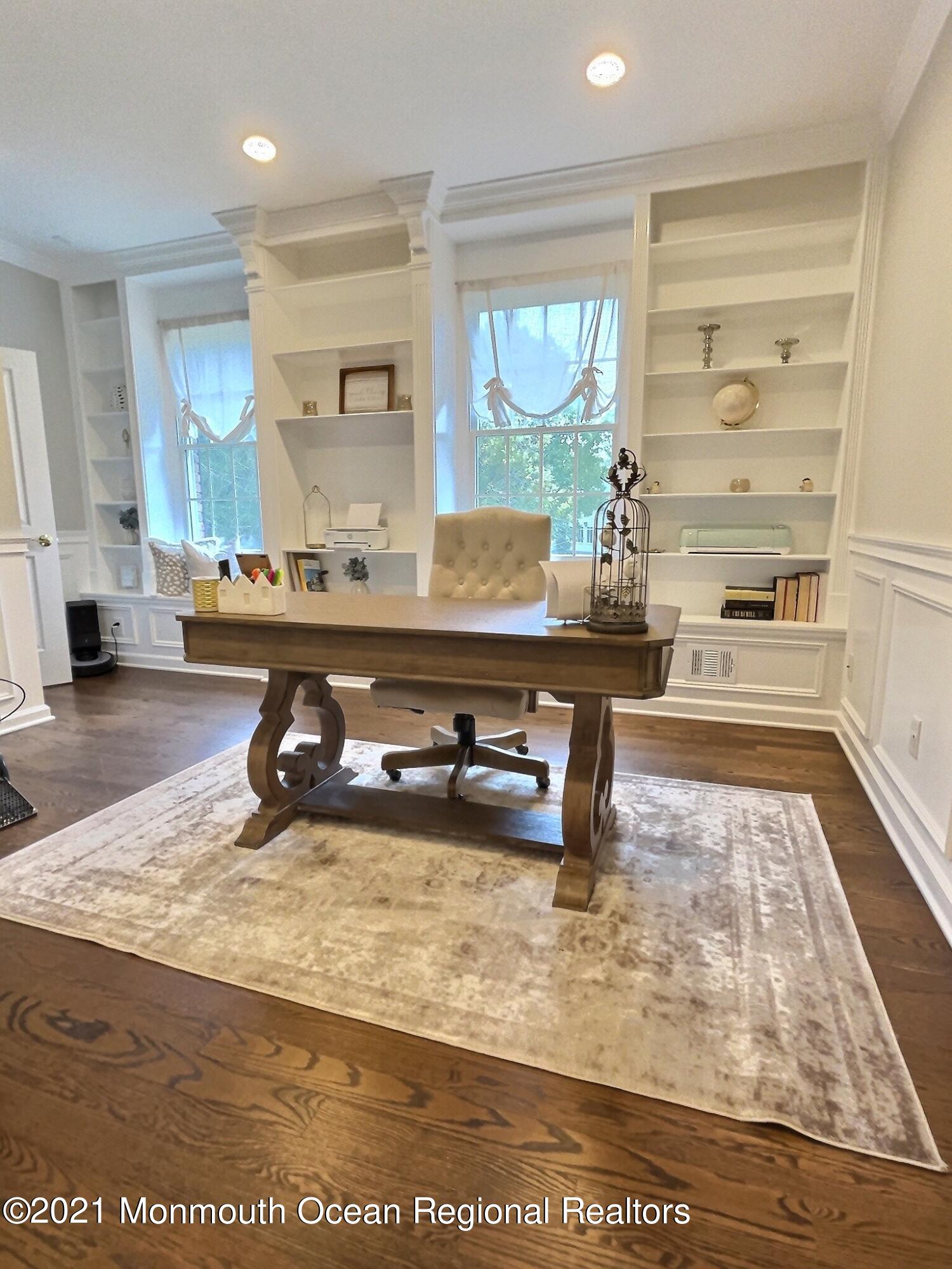21 Dearborn Drive Holmdel, NJ 07733 - Photo 20 of 48 a living room with table and chairs