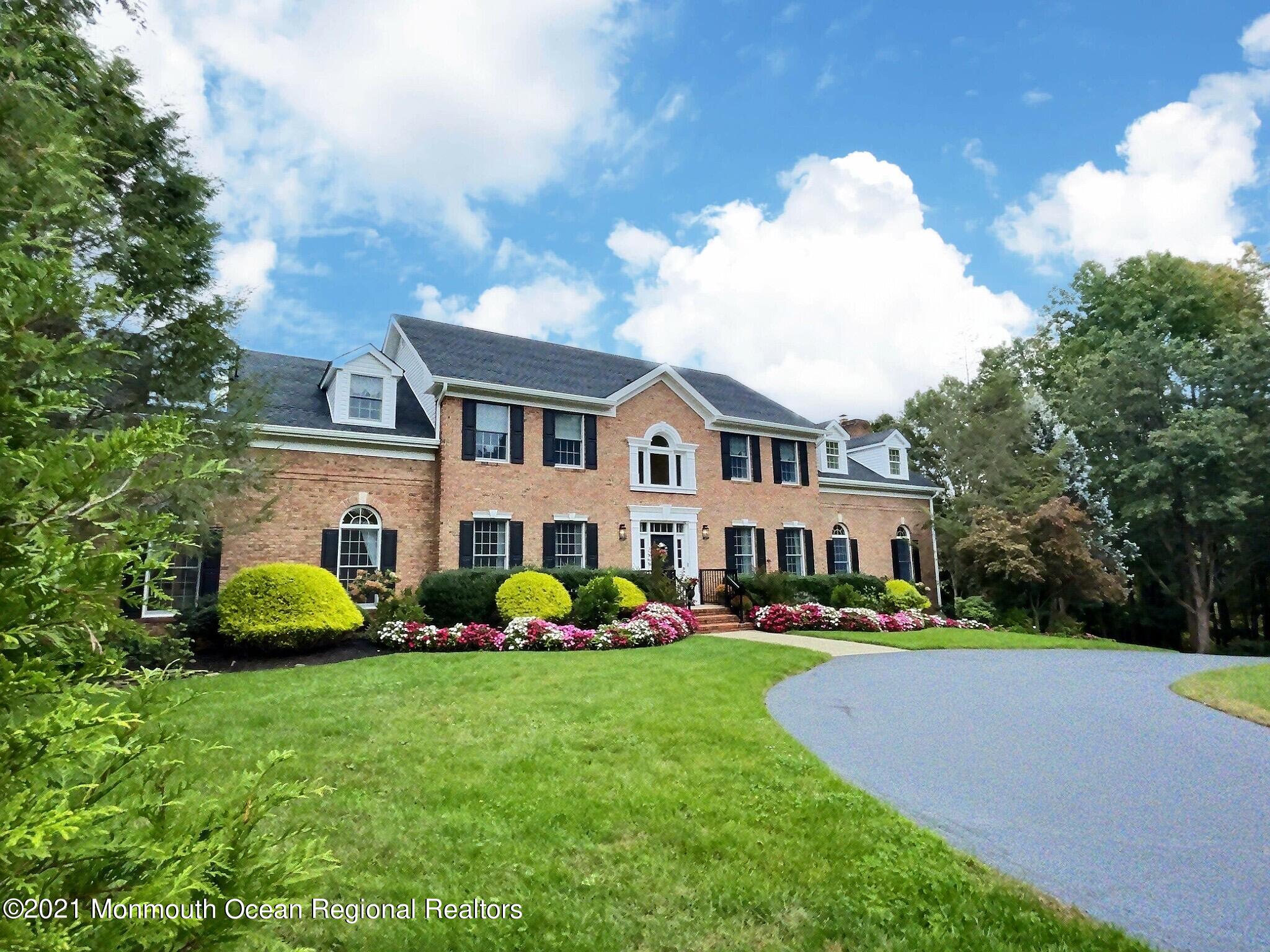 21 Dearborn Drive Holmdel, NJ 07733 - Photo 2 of 48 a front view of building with yard and trees