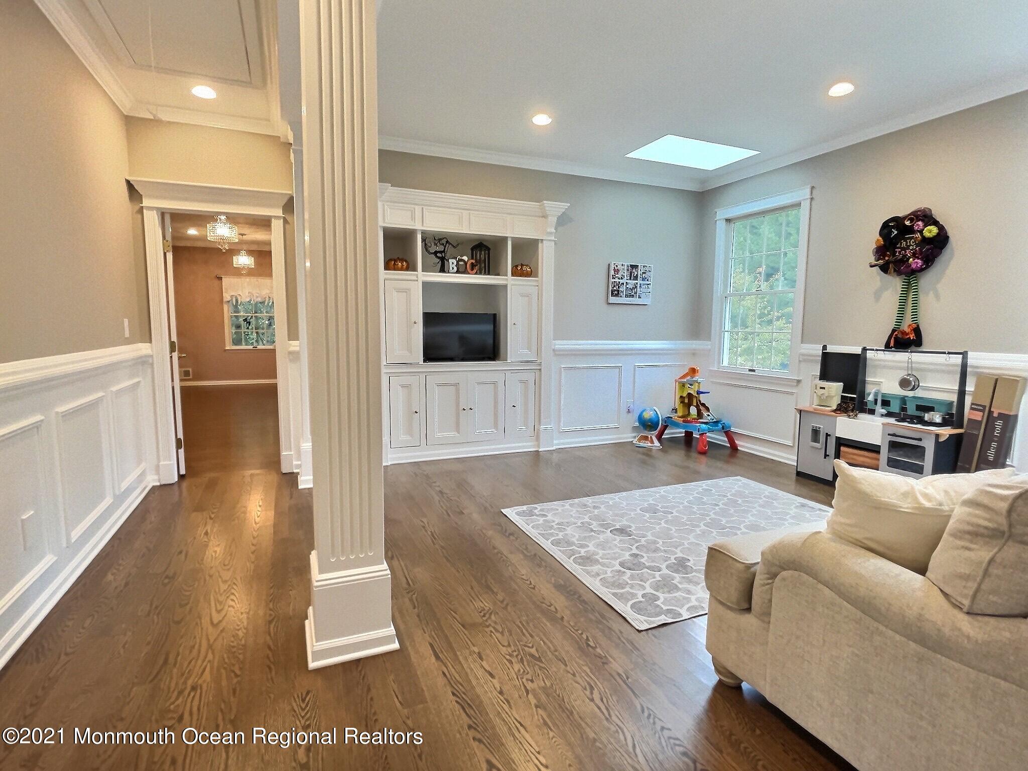 21 Dearborn Drive Holmdel, NJ 07733 - Photo 22 of 48 a living room with furniture and a table