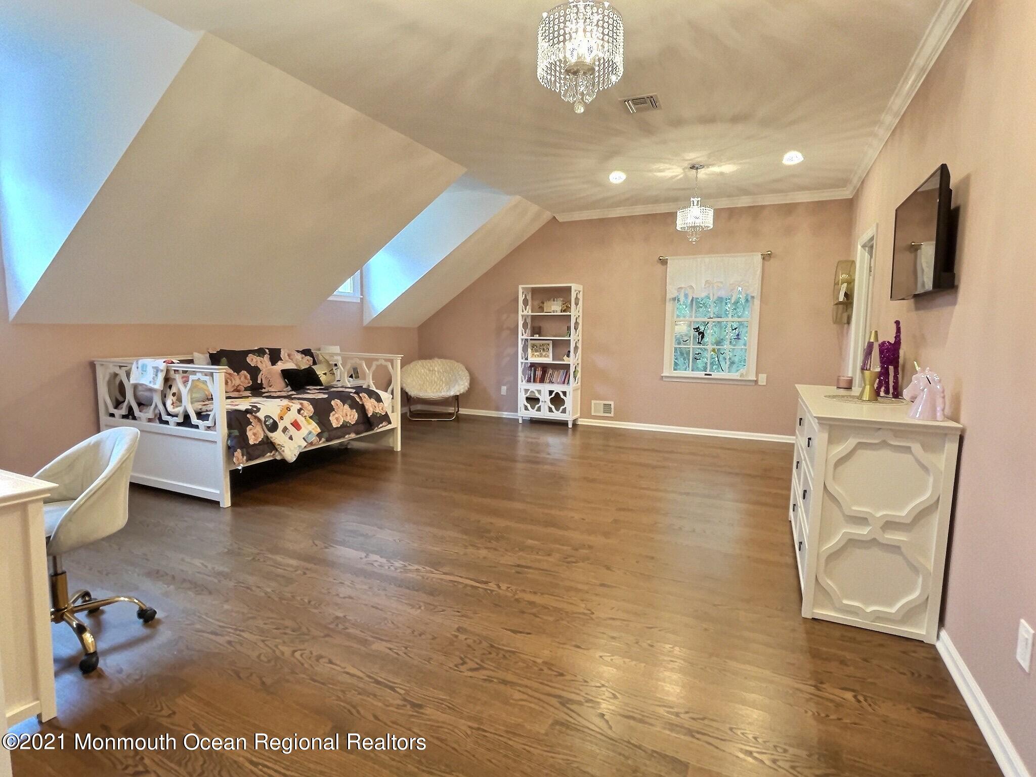 21 Dearborn Drive Holmdel, NJ 07733 - Photo 23 of 48 a living room with furniture and a flat screen tv