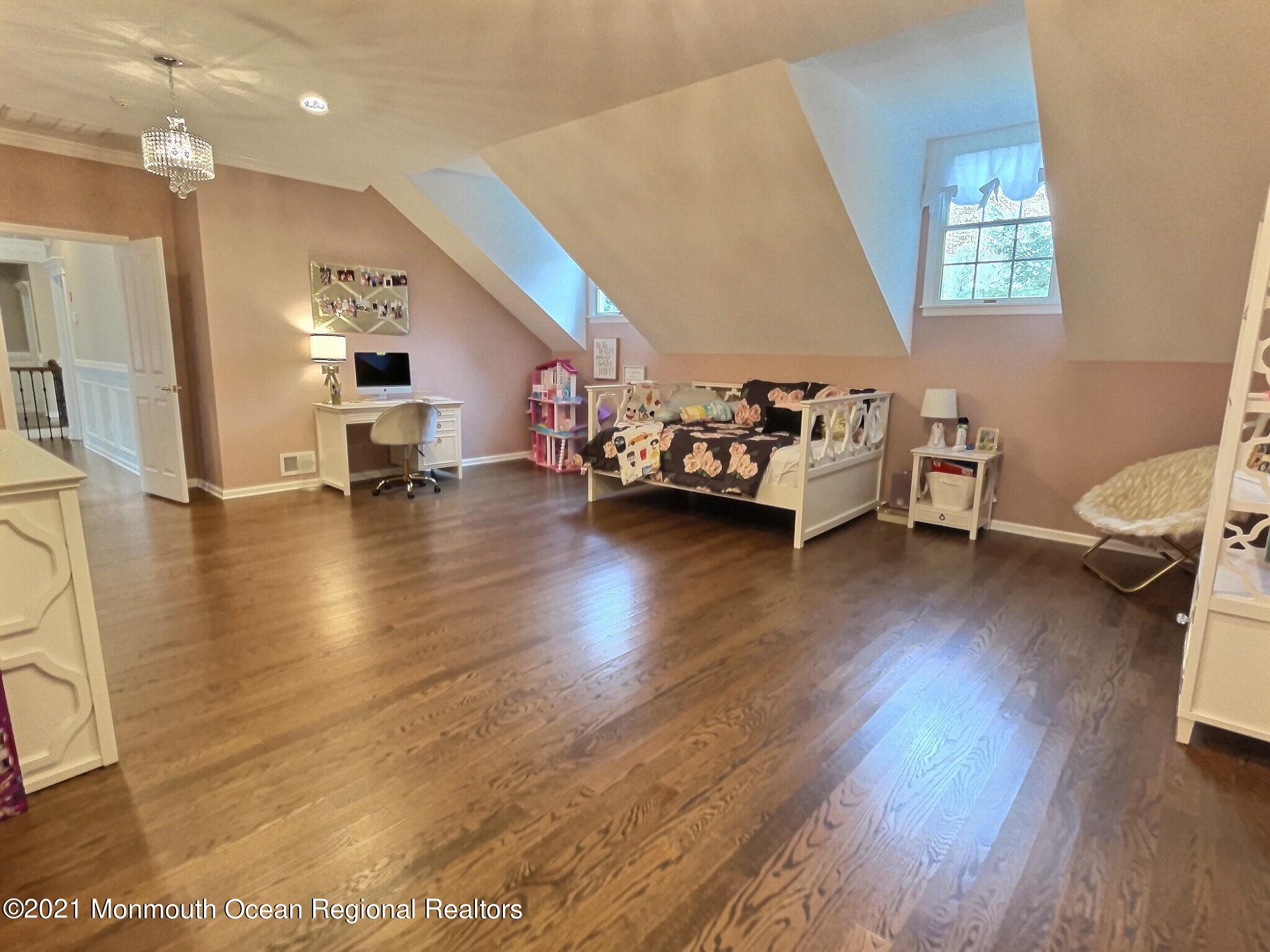 21 Dearborn Drive Holmdel, NJ 07733 - Photo 24 of 48 a living room with furniture and a wooden floor