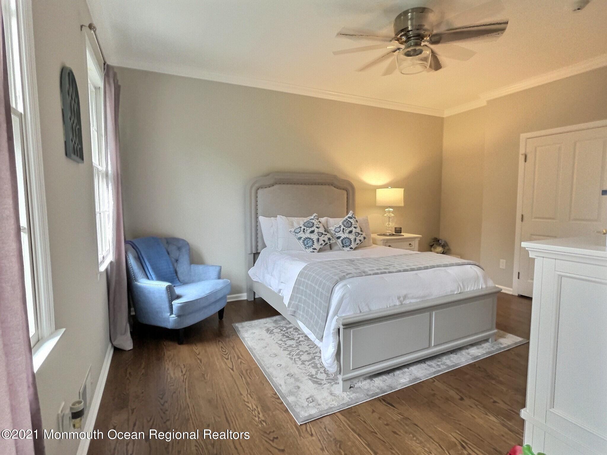 21 Dearborn Drive Holmdel, NJ 07733 - Photo 31 of 48 a bedroom with a bed and a couch