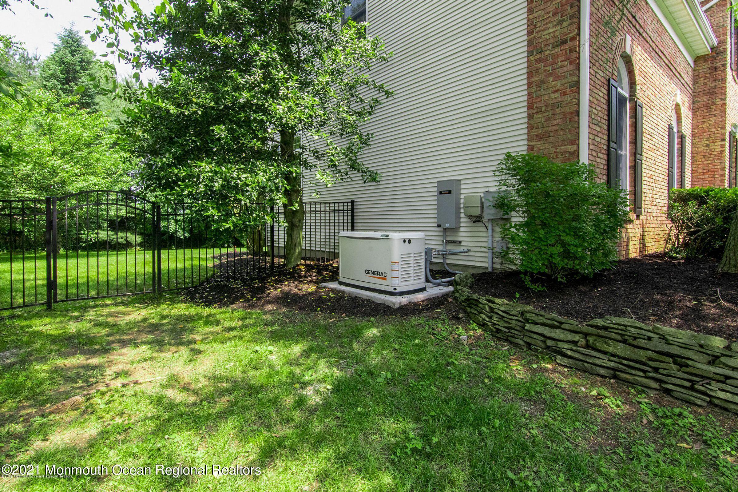 21 Dearborn Drive Holmdel, NJ 07733 - Photo 46 of 48 a view of a backyard with a garden and entertaining space