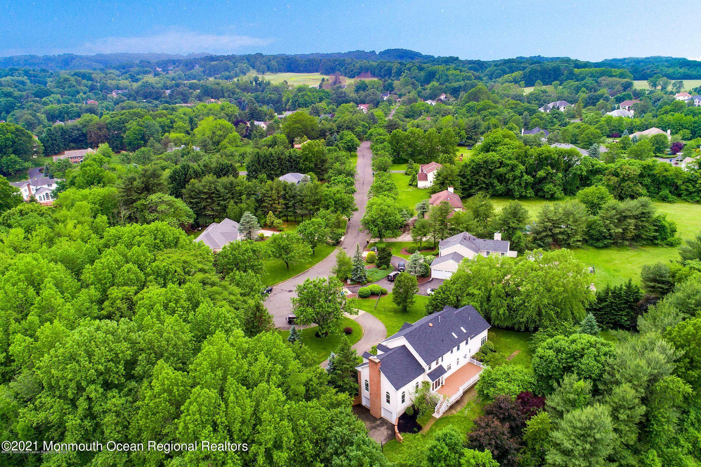 21 Dearborn Drive Holmdel, NJ 07733 - Photo 48 of 48 an aerial view of residential house with outdoor space and trees all around