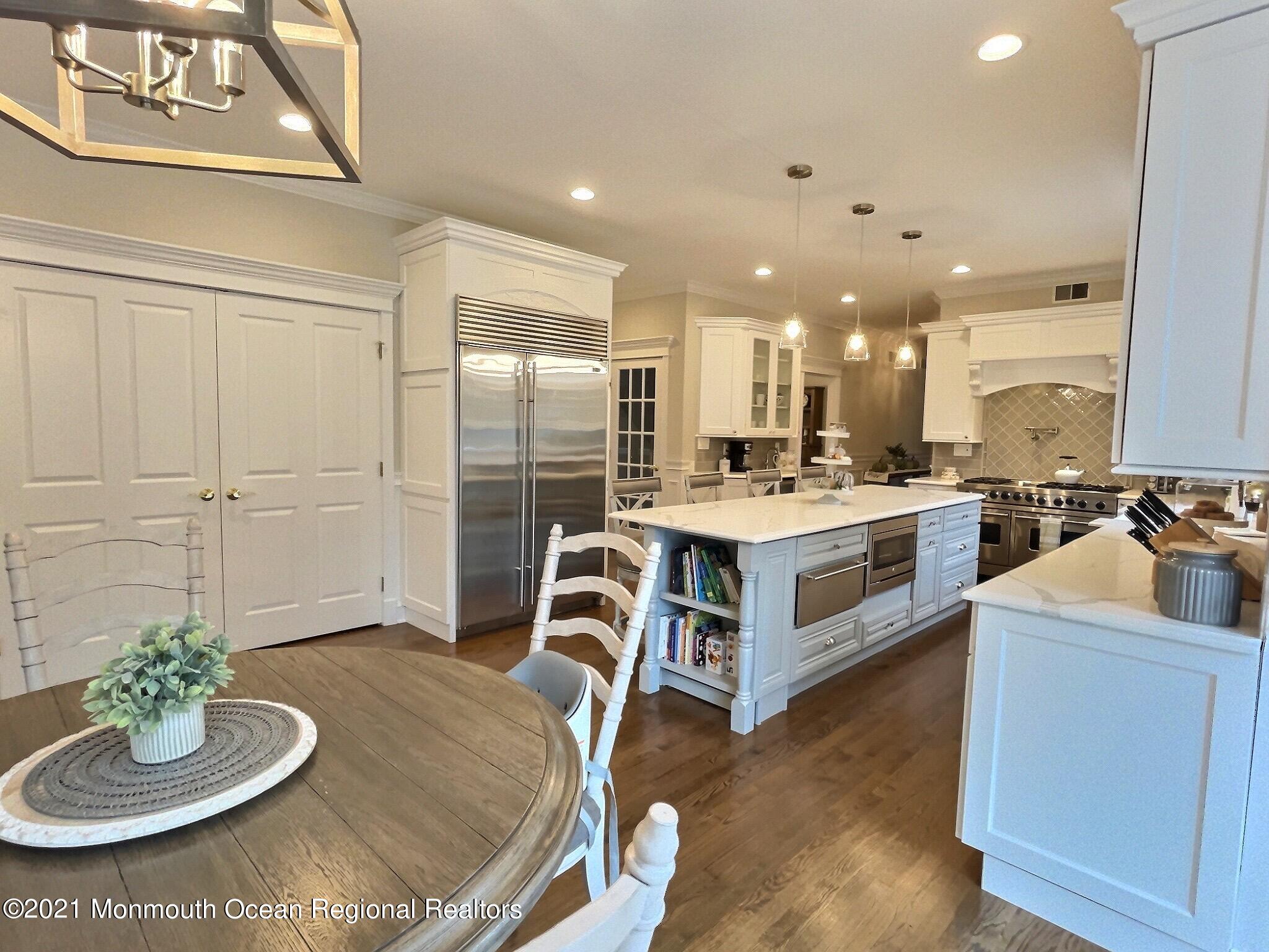 21 Dearborn Drive Holmdel, NJ 07733 - Photo 5 of 48 a kitchen with kitchen island granite countertop lots of counter top space