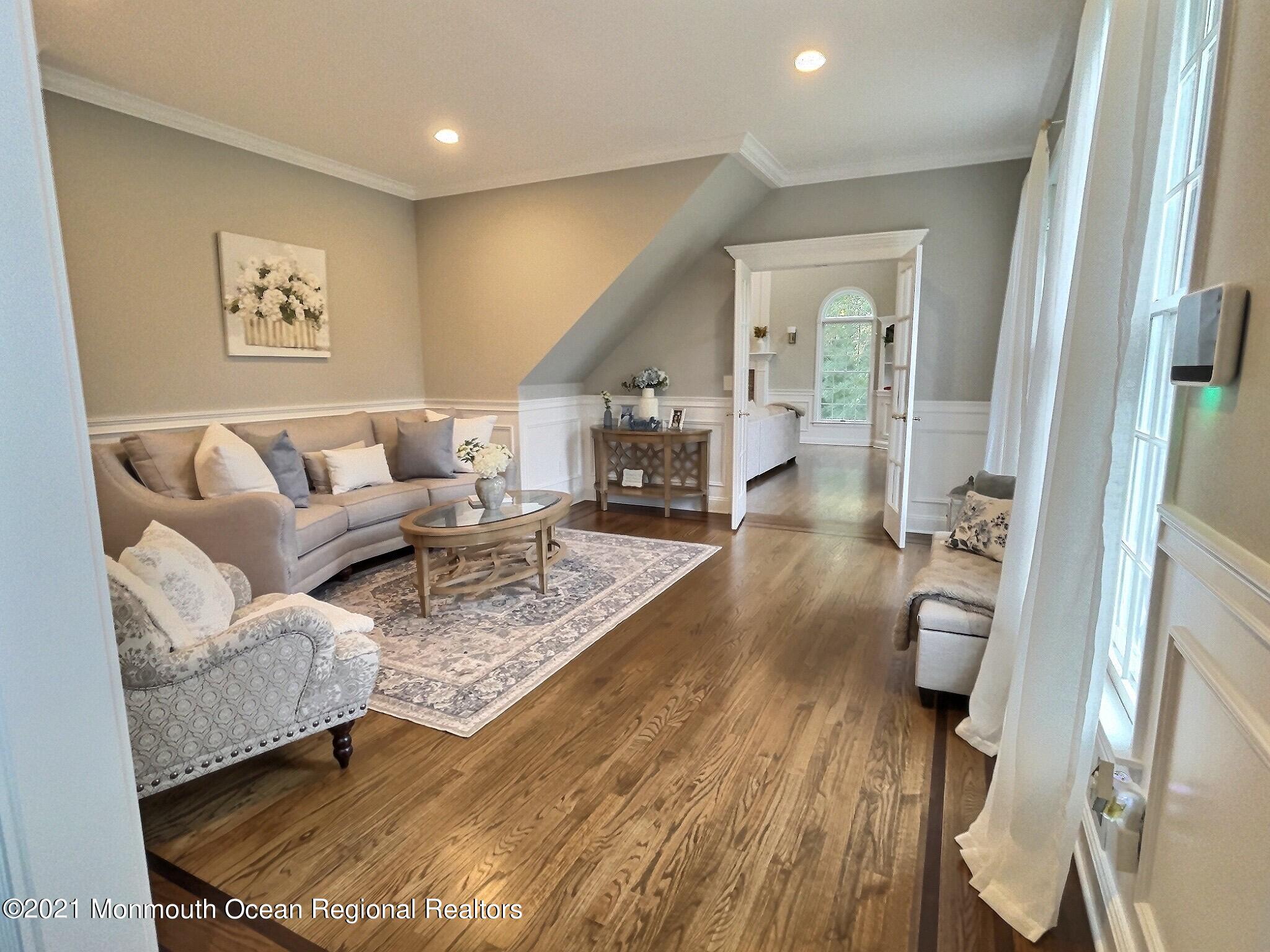 21 Dearborn Drive Holmdel, NJ 07733 - Photo 10 of 48 a living room with furniture and wooden floor