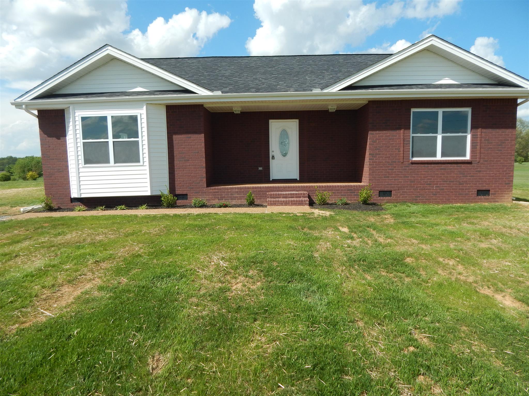 574 Cook Road Portland, TN 37148 - Photo 1 of 12 a front view of a house with a yard