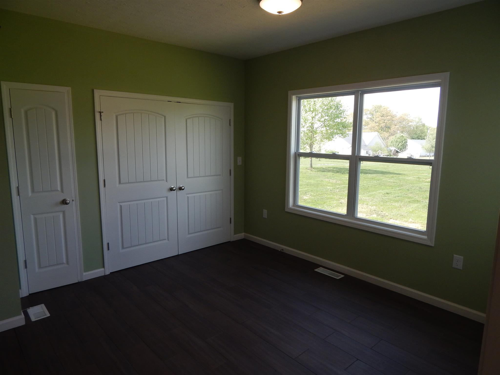 574 Cook Road Portland, TN 37148 - Photo 9 of 12 a view of an empty room with wooden floor and a window