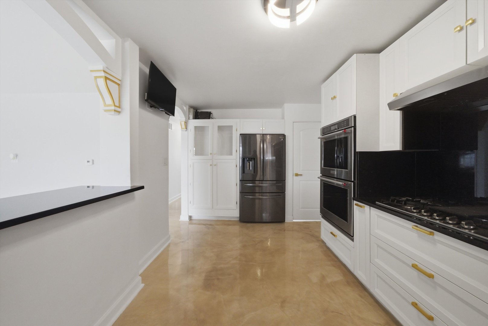 3853 West 83rd Place Chicago, IL 60652 - Photo 11 of 30 a view of a kitchen with refrigerator and microwave