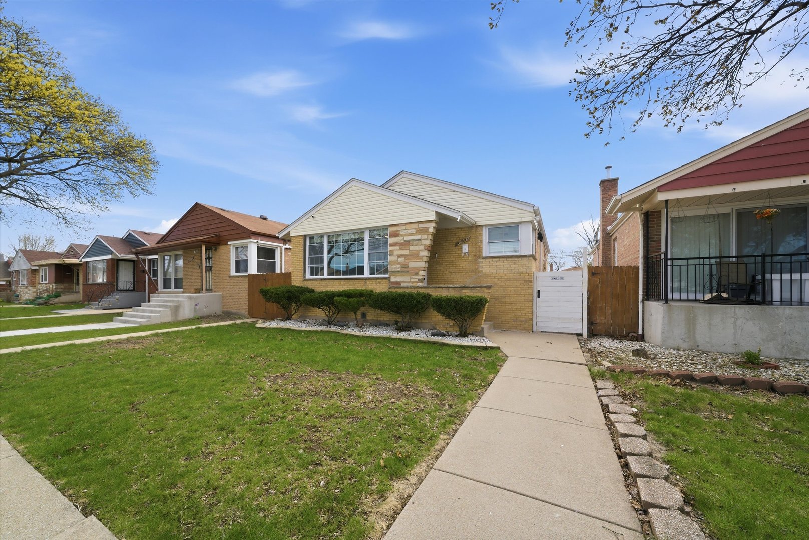 3853 West 83rd Place Chicago, IL 60652 - Photo 2 of 30 a front view of a house with a garden and yard
