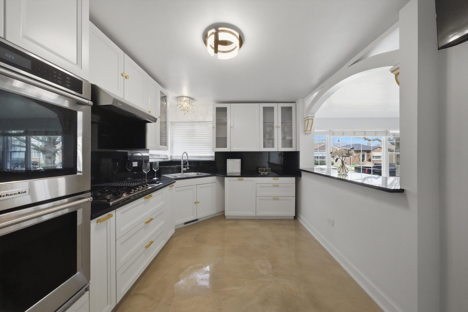 3853 West 83rd Place Chicago, IL 60652 - Photo 10 of 30 a large white kitchen with a large window