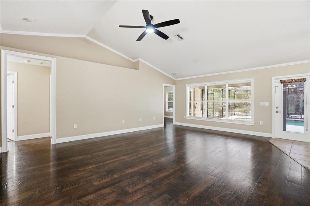 26 Statice Court Homosassa, FL 34446 - Photo 12 of 70 wooden floor in an empty room with a window