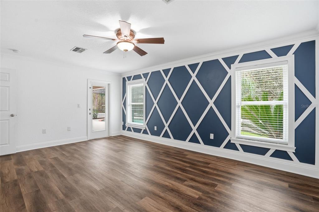 26 Statice Court Homosassa, FL 34446 - Photo 28 of 70 an empty room with wooden floor fan and windows