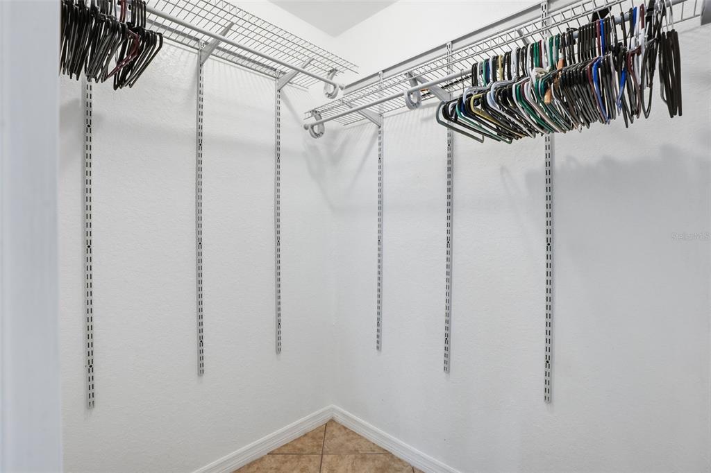 26 Statice Court Homosassa, FL 34446 - Photo 35 of 70 a view of walk in closet with clothes and shoes