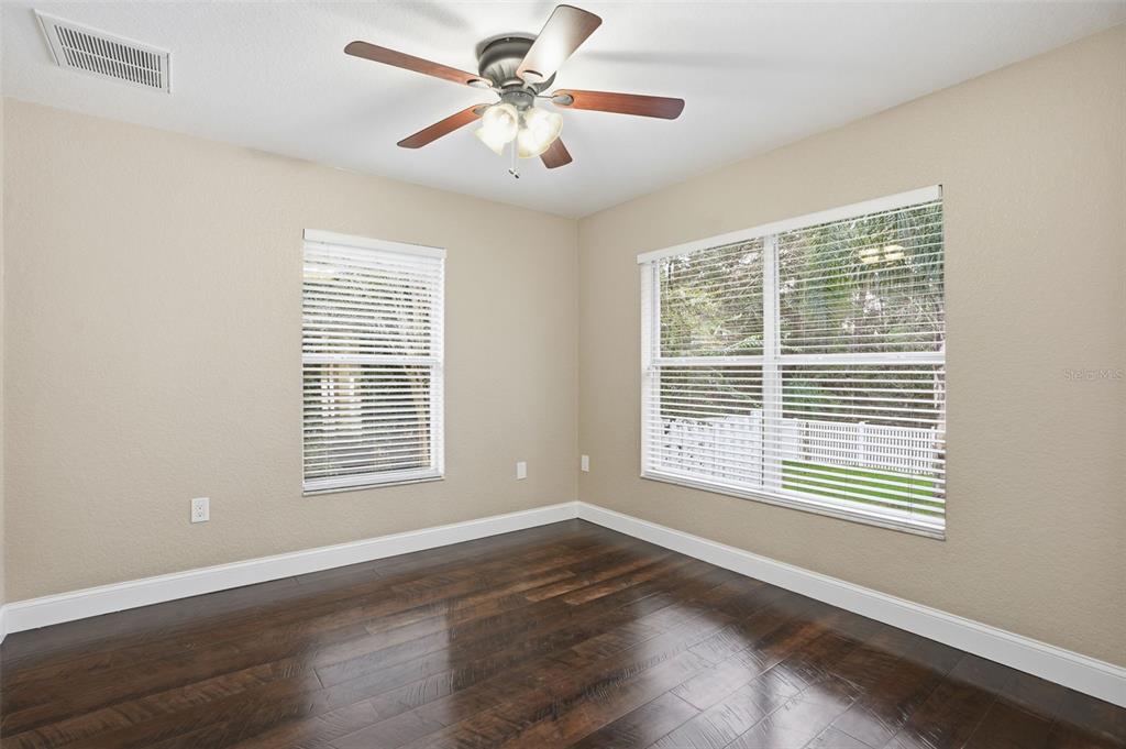 26 Statice Court Homosassa, FL 34446 - Photo 37 of 70 a view of an empty room with a window and wooden floor