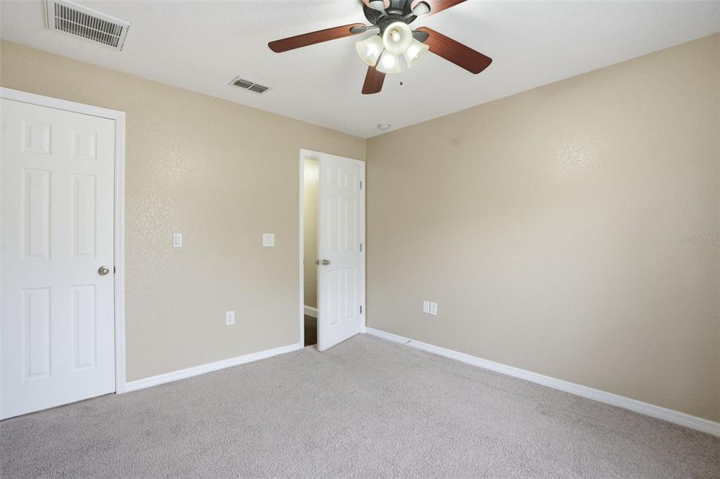 26 Statice Court Homosassa, FL 34446 - Photo 39 of 70 an empty room with chandelier fan
