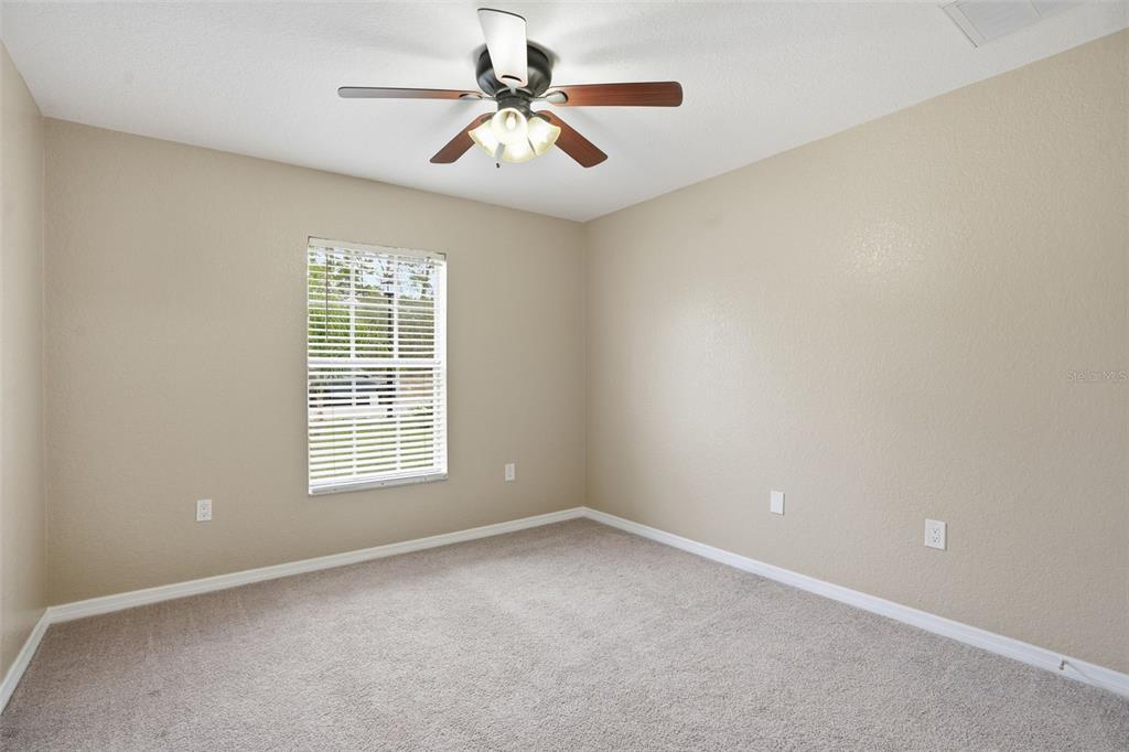 26 Statice Court Homosassa, FL 34446 - Photo 41 of 70 an empty room with a window and a fan