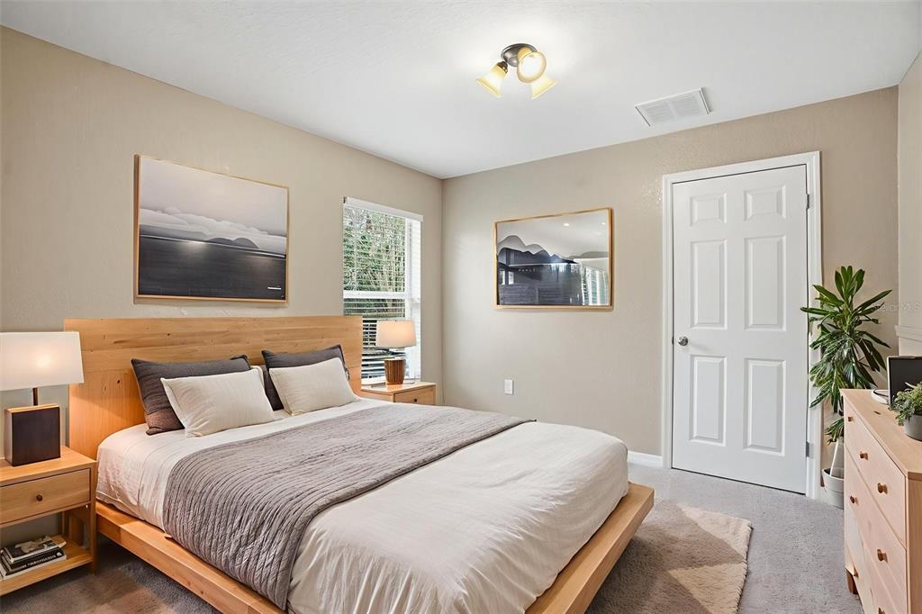 26 Statice Court Homosassa, FL 34446 - Photo 43 of 70 a bedroom with a bed and a painting on the wall