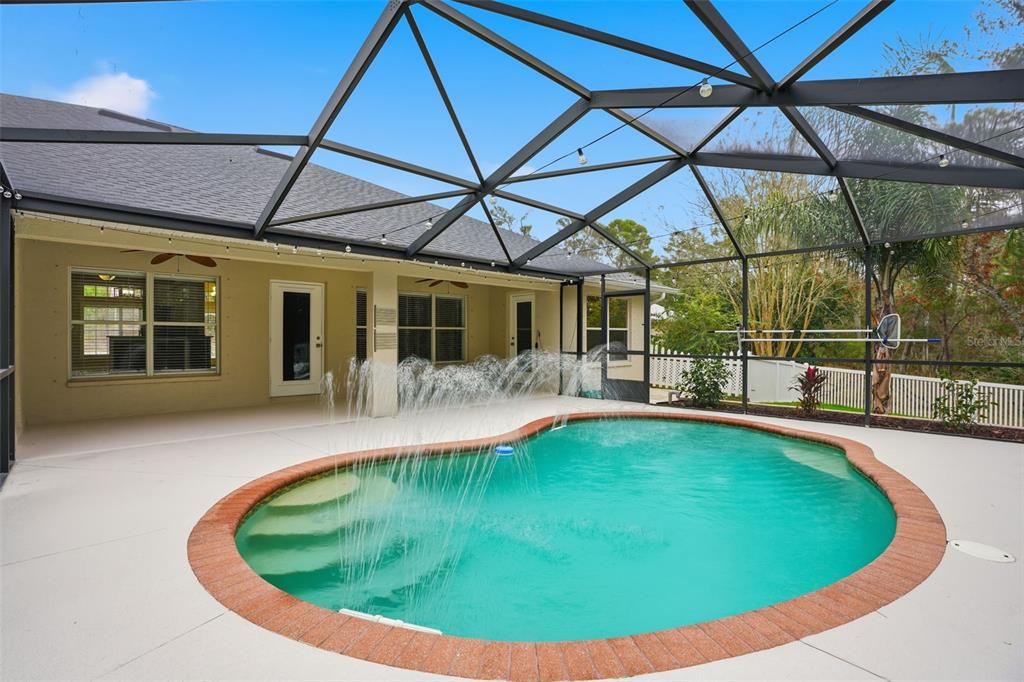 26 Statice Court Homosassa, FL 34446 - Photo 50 of 70 a view of a swimming pool with a yard chairs