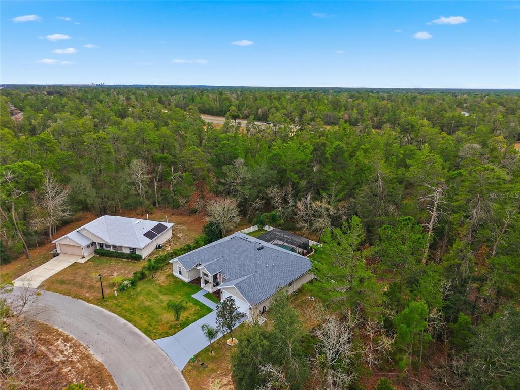 26 Statice Court Homosassa, FL 34446 - Photo 60 of 70 a view of a garden with an outdoor space