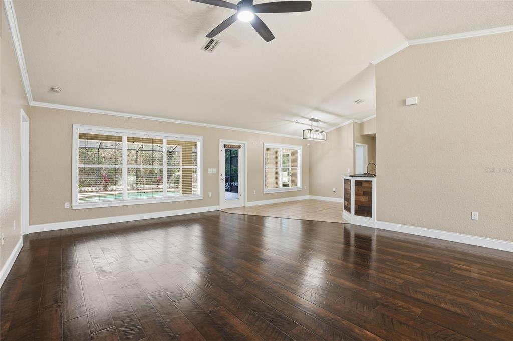 26 Statice Court Homosassa, FL 34446 - Photo 8 of 70 a view of an empty room with wooden floor and a window
