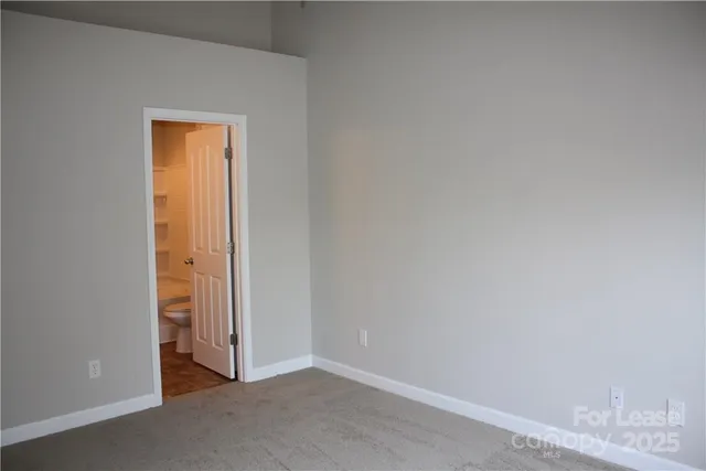 a kitchen with stainless steel appliances granite countertop a stove a refrigerator a sink and dishwasher with wooden floor