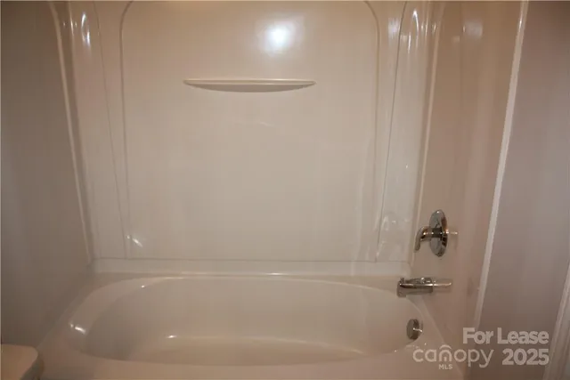 a close view of a bathtub in bathroom