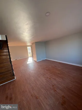 a view of an empty room with stairs