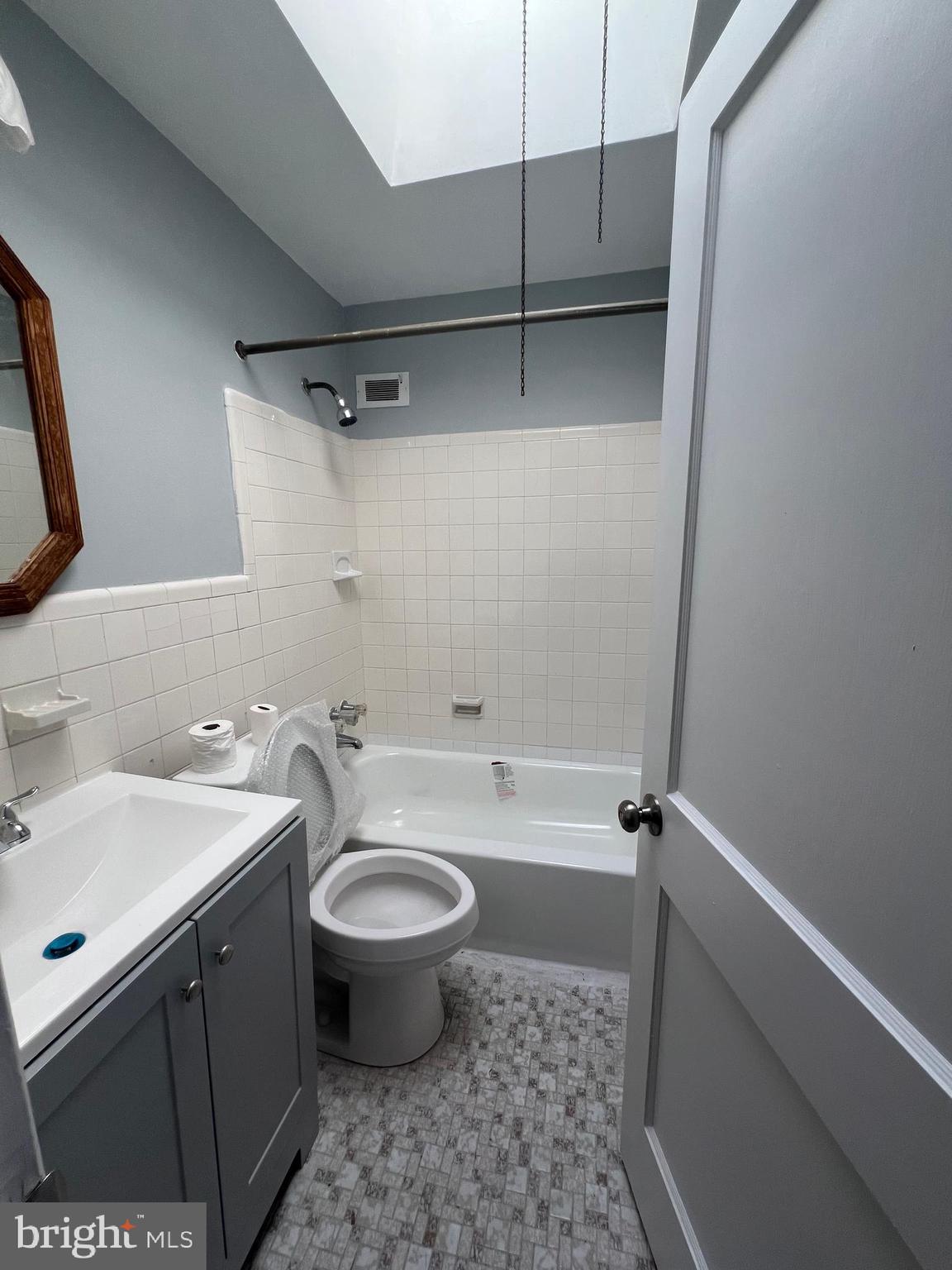 2056 Robbins Street Philadelphia, PA 19149 - Photo 7 of 9 a bathroom with a sink a toilet and shower
