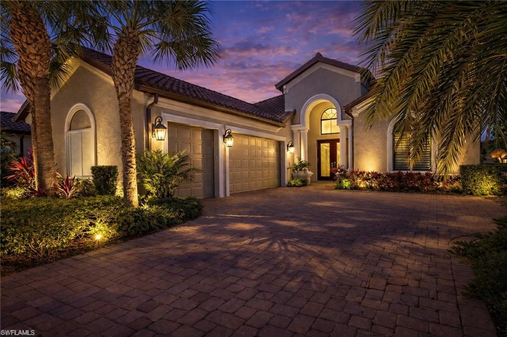 Mediterranean / spanish-style house with stucco siding, decorative driveway, an attached garage, and a tile roof