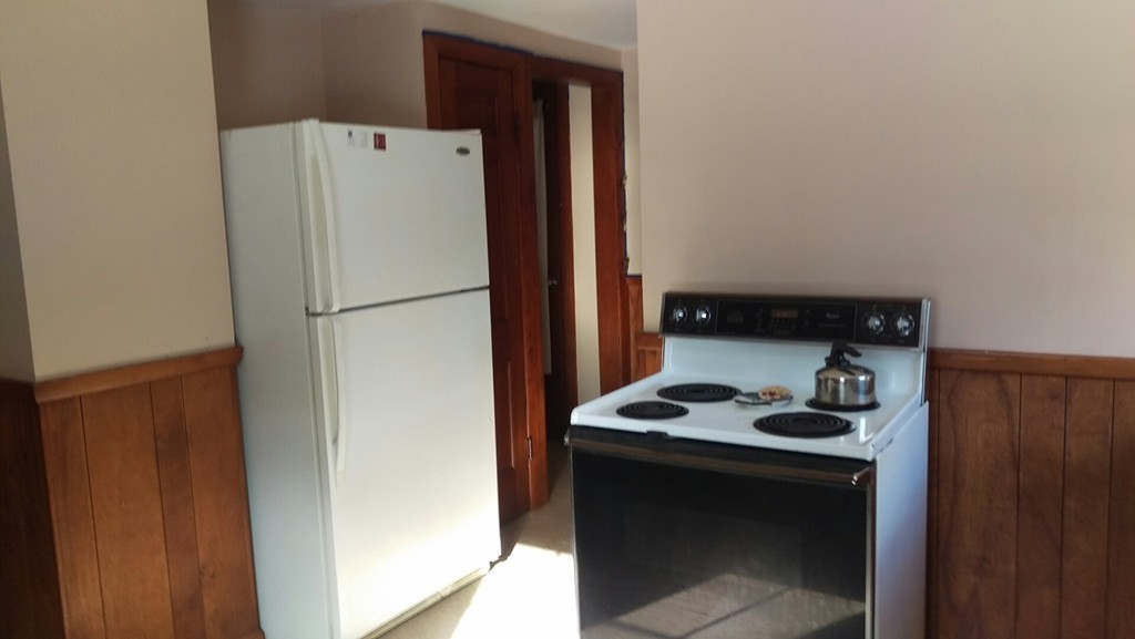 339 Abbe Road Enfield, CT 06082 - Photo 6 of 14 a white refrigerator freezer sitting in a kitchen