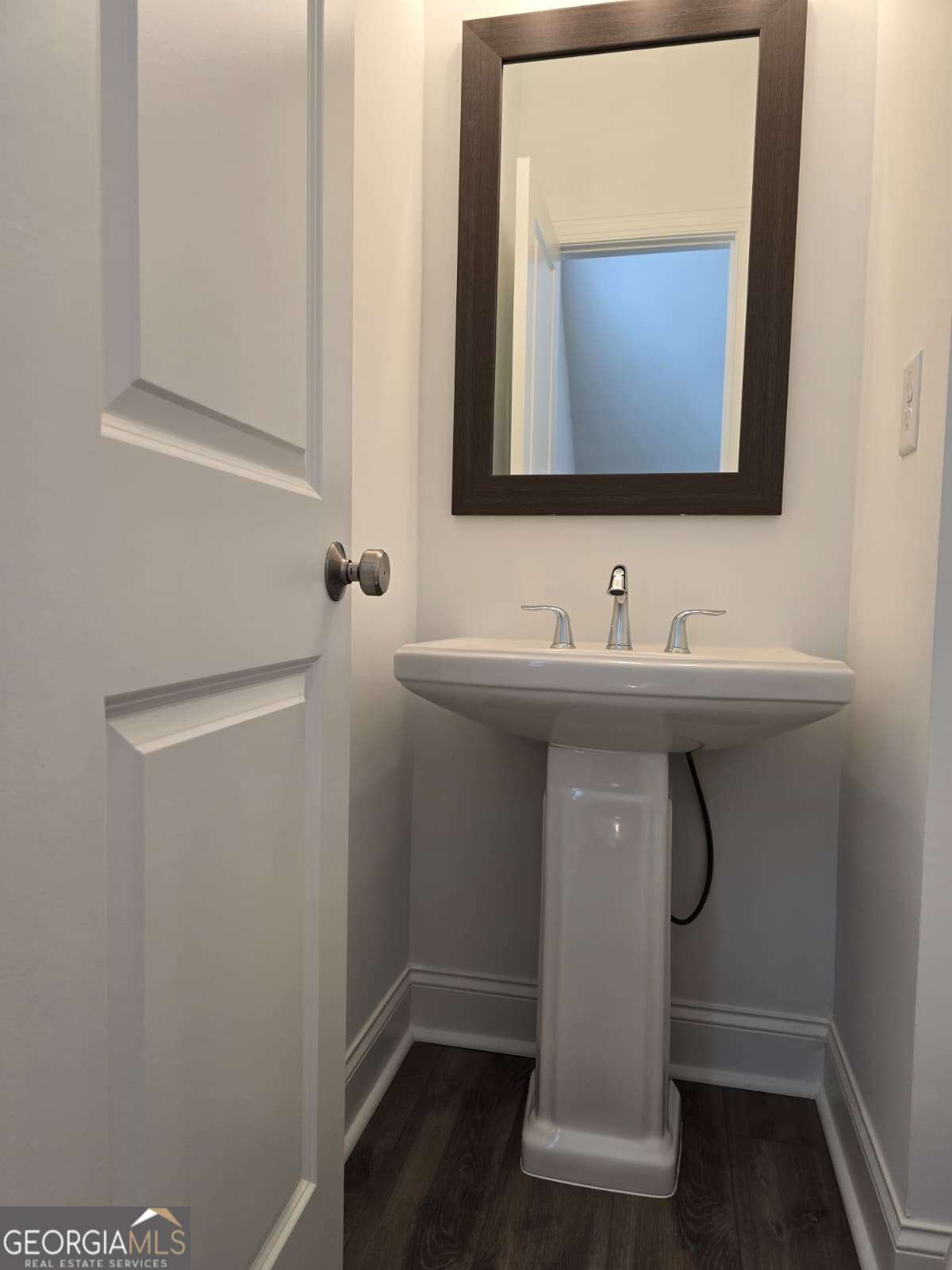 825 Green Sapling Trail, Unit 18 Suwanee, GA 30024 - Photo 17 of 44 a bathroom with a sink and a mirror