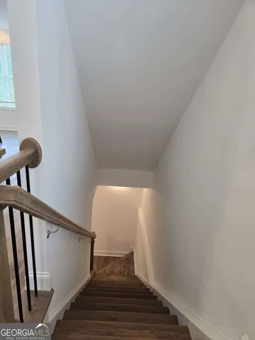 a white toilet sitting next to a bath tub