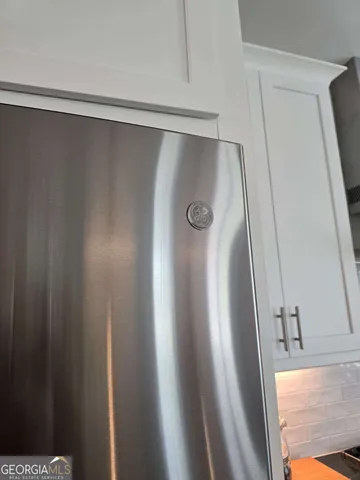 a view of storage and utility room with washer and dryer