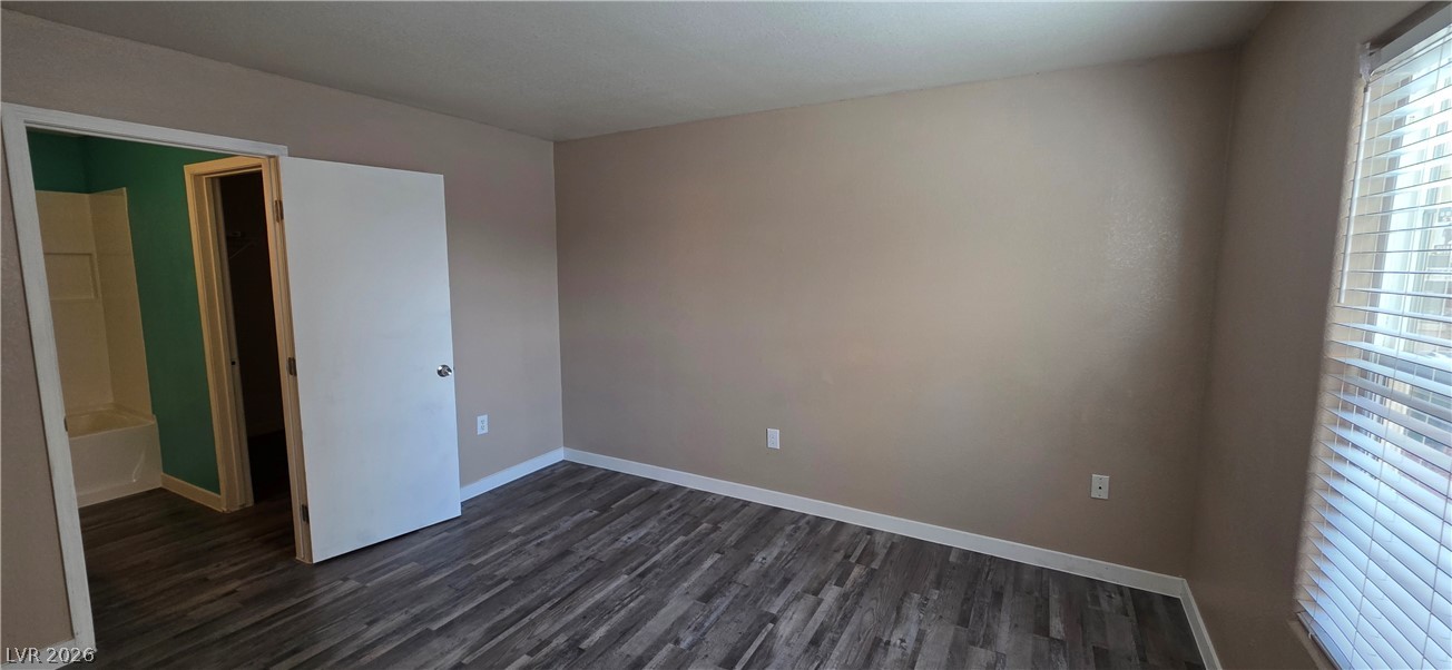 1830 North Pecos Road, Unit 142 Las Vegas, NV 89115 - Photo 14 of 19 Laminate flooring throughout offers easy maintenance in this well-appointed bedroom.