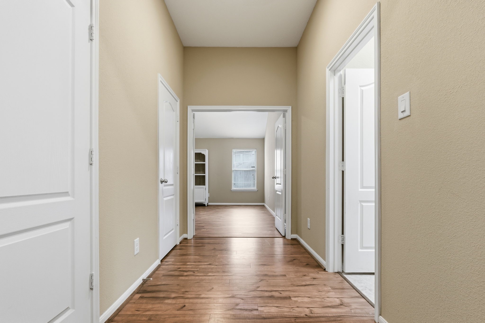 1810 Nantz Lane Conroe, TX 77304 - Photo 11 of 23 a view of a hallway with wooden floor