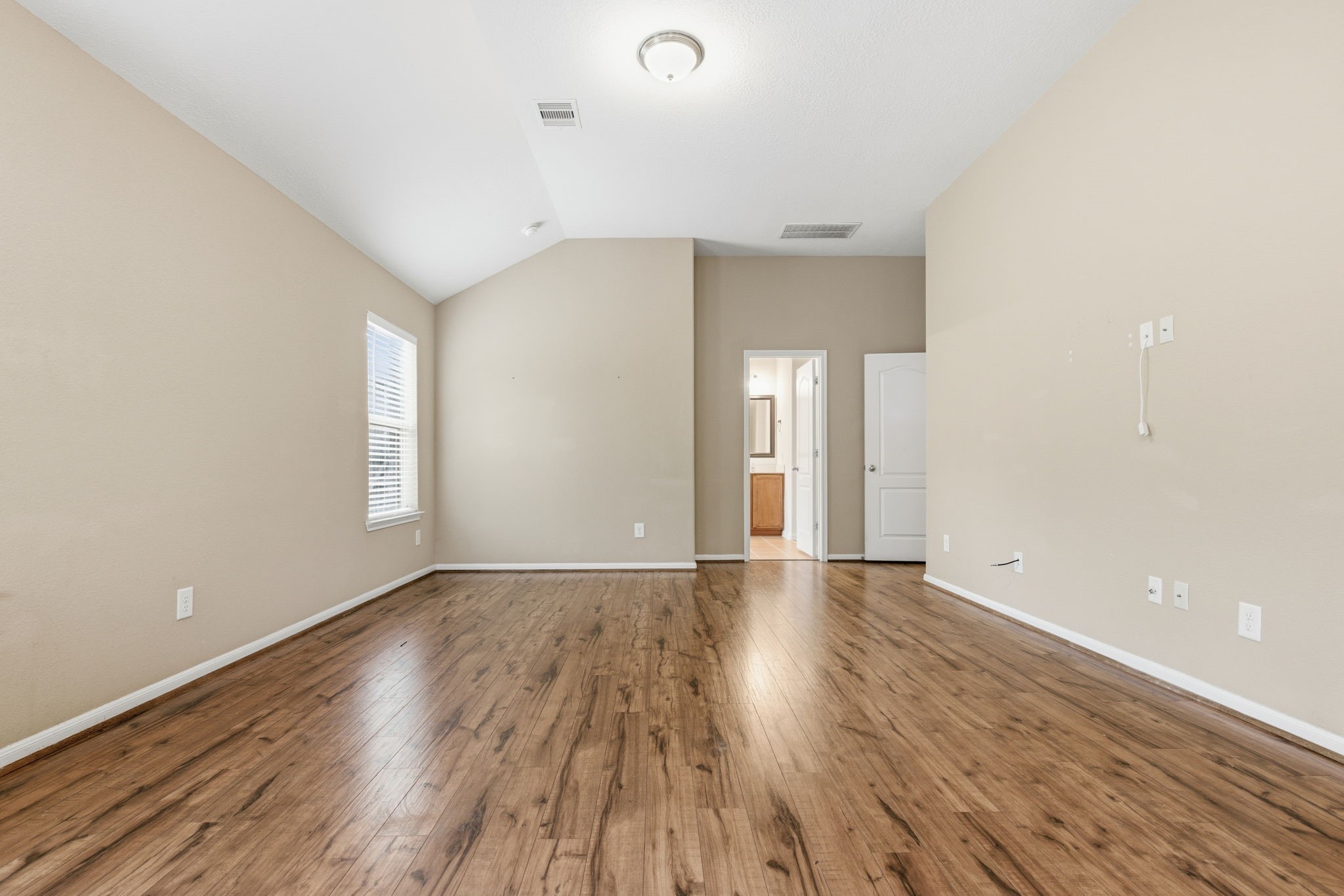 1810 Nantz Lane Conroe, TX 77304 - Photo 14 of 23 wooden floor in an empty room with a window