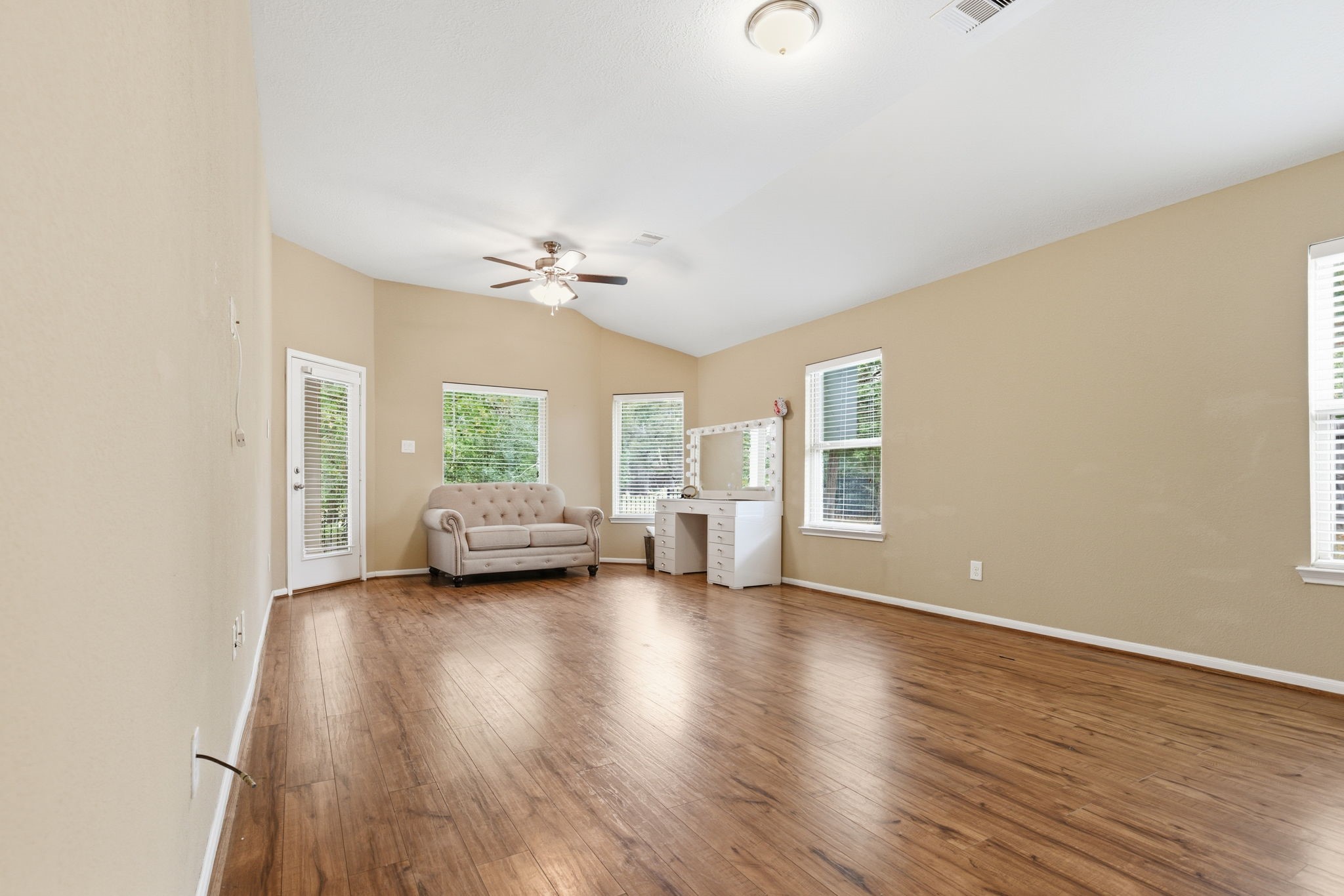 1810 Nantz Lane Conroe, TX 77304 - Photo 16 of 23 a view of an empty room with a window and wooden floor