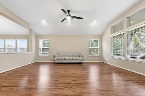 a view of livingroom with furniture window and wooden floor