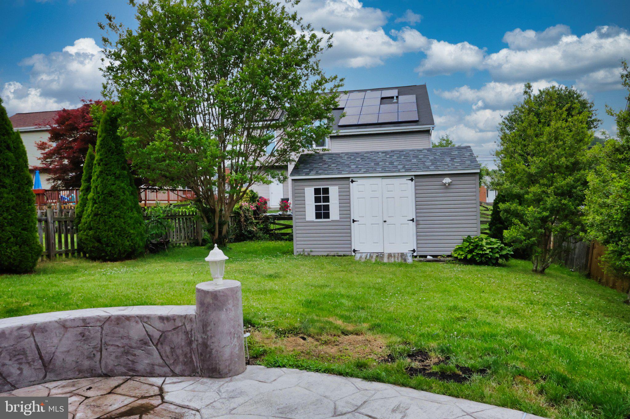4402 Fieldgreen Road Nottingham, MD 21236 - Photo 50 of 52 Charming backyard with a garden shed.